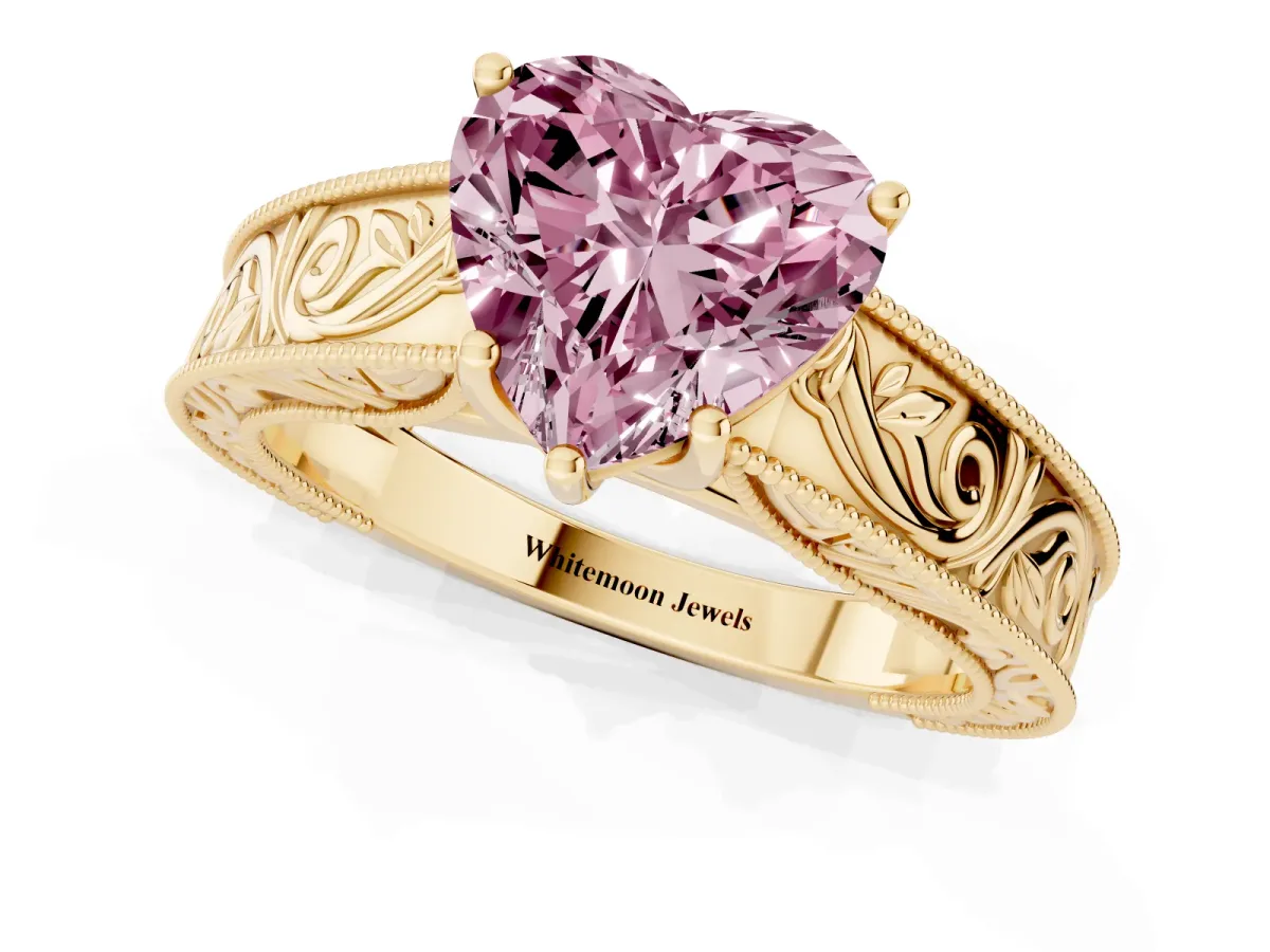 Fancy Pink Heart Cut Diamond Solitaire Ring with Engraved Band and Four-Prong Setting Yellow gold