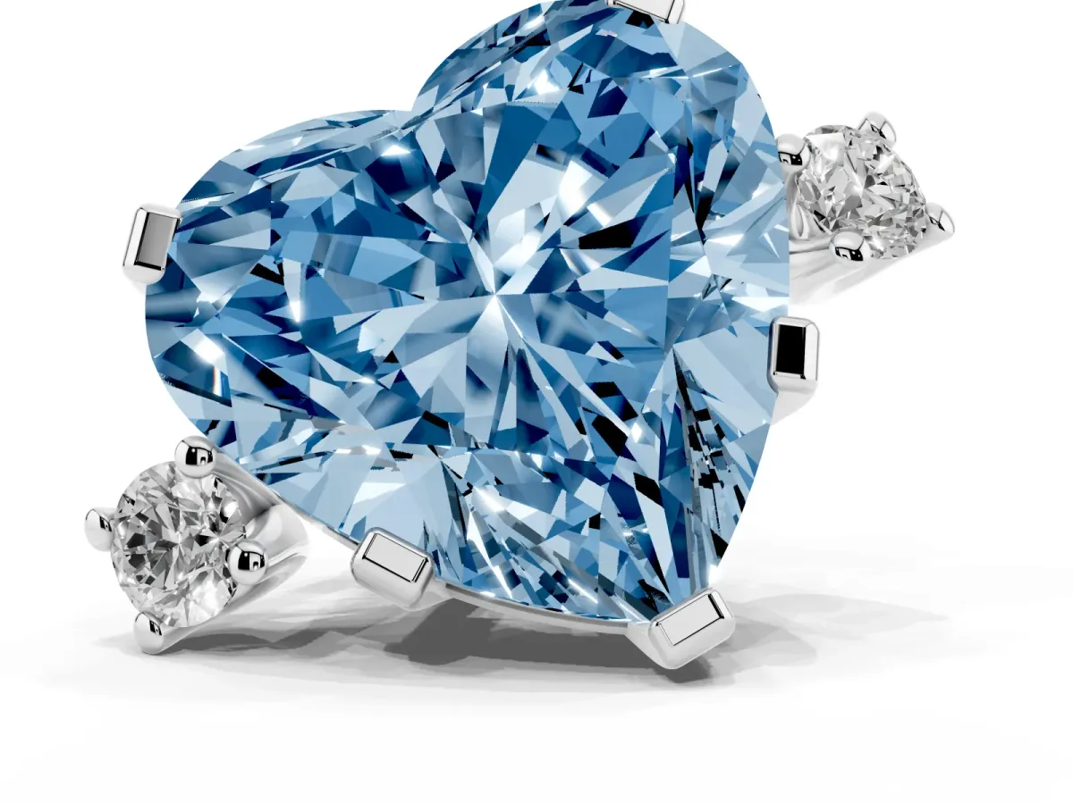 Fancy Blue Heart Cut Cut Three-Stone Solitaire Ring with Round Accent Diamonds and Four-Prong Setting Silver