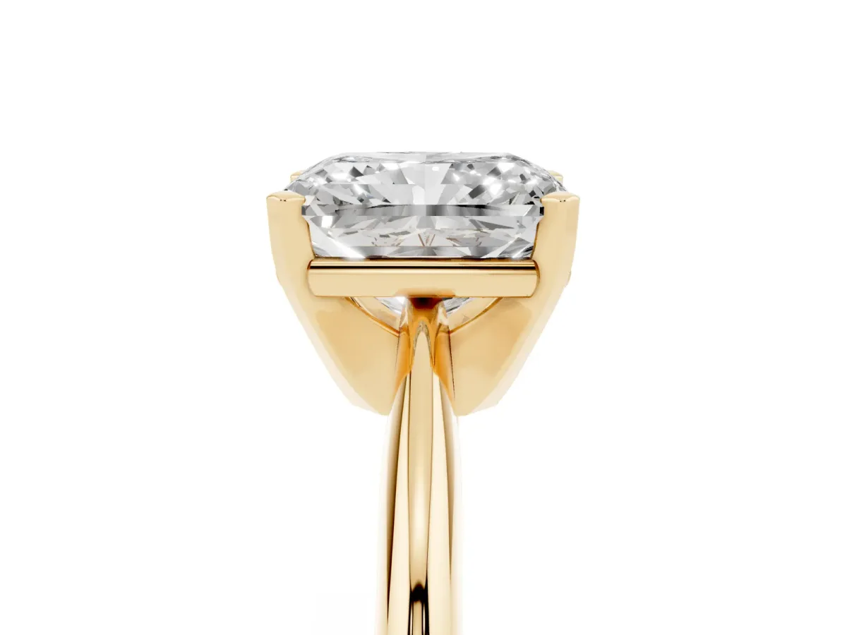 Radiant Cut Cut Solitaire Ring with Four-Prong Setting on a Classic Band Yellow gold
