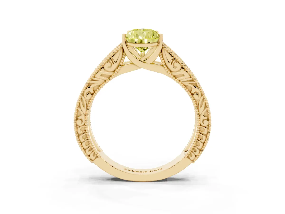Fancy Yellow Pear Cut Diamond Solitaire Ring with Engraved Band and Four-Prong Setting Yellow gold