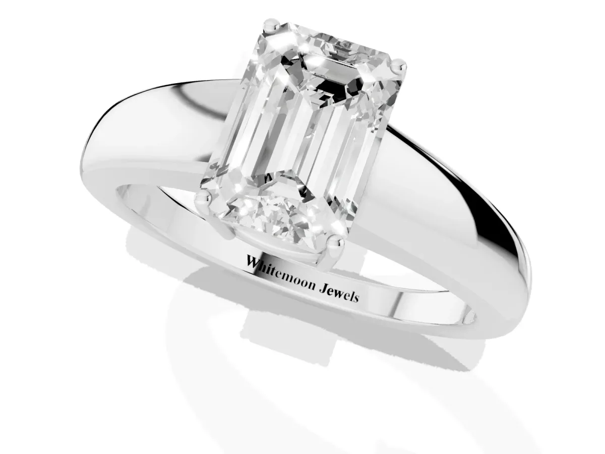 Emerald Cut Solitaire Diamond Ring with Tapered Band and Four-Prong Setting White gold