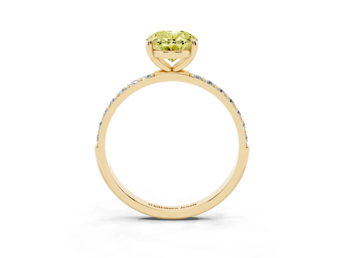 Fancy Yellow Oval Cut Diamond Solitaire Ring with Round Pavé Band and Prong Setting Yellow gold