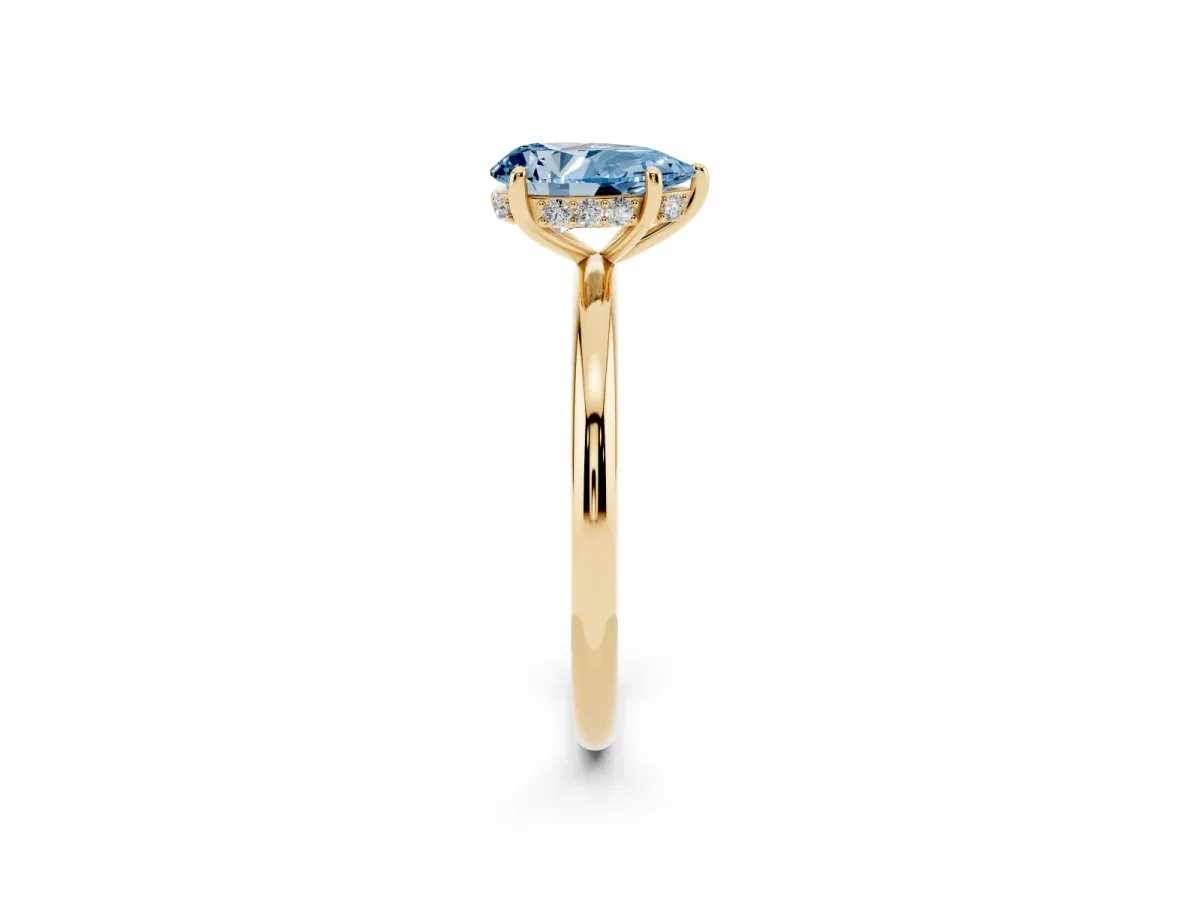 Fancy Blue Pear Cut Solitaire Diamond Ring with a Classic Band and Four-Prong Setting Yellow gold