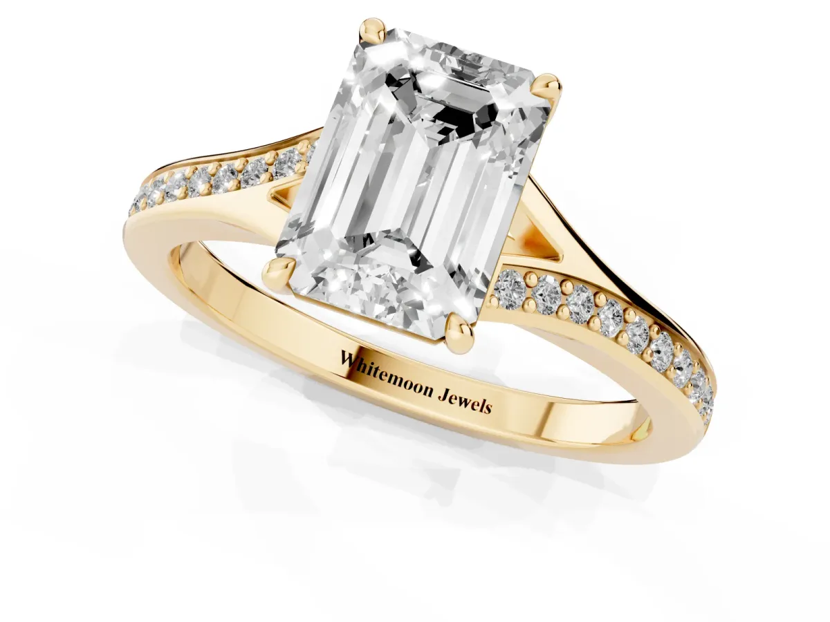 Emerald Cut Diamond Solitaire Ring with Pavé Band and Prong Setting Yellow gold