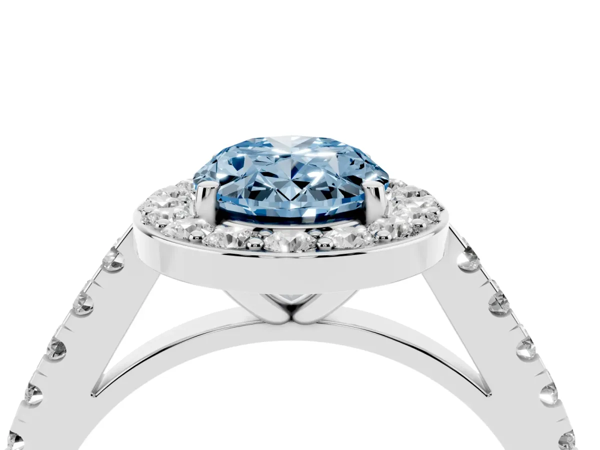 Fancy Blue Oval Cut Diamond Halo Ring with Round Pavé Split Shank and Prong Setting Platinum