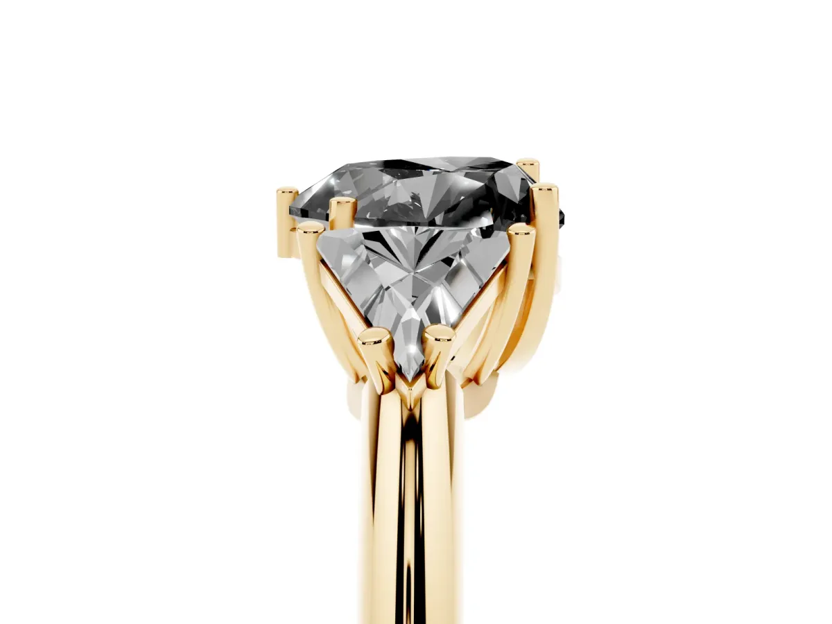 Fancy Black Three-Stone Heart Cut Diamond Engagement Ring with Trillion Side Stones and Prong Setting Yellow gold