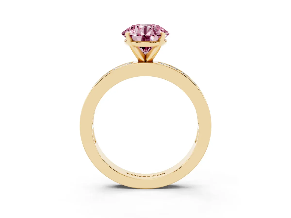 Fancy Pink Round Cut Solitaire Diamond Ring with Channel-Set Baguette Band and Four-Prong Setting Yellow gold
