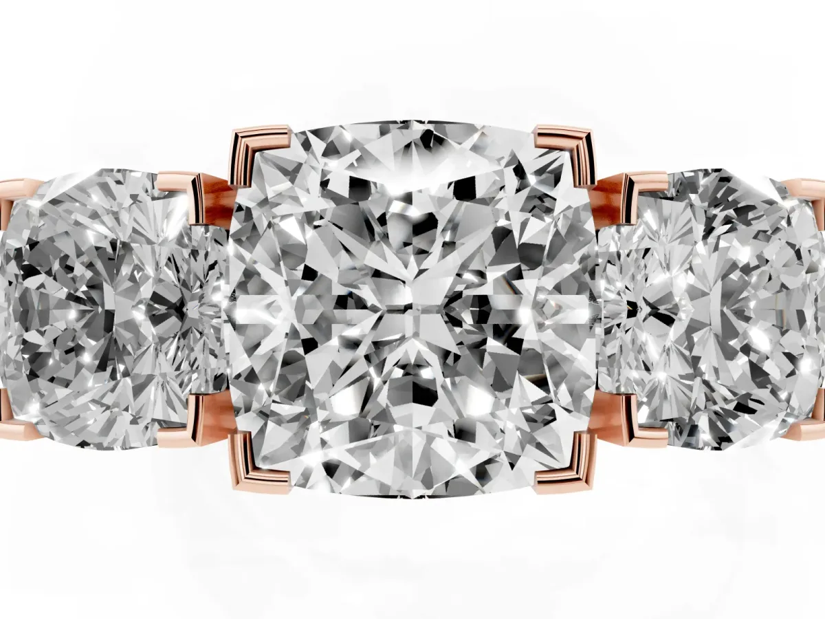 Three-Stone Cushion Cut Cut Diamond Ring with Channel Set Band and Four-Prong Setting Rose gold
