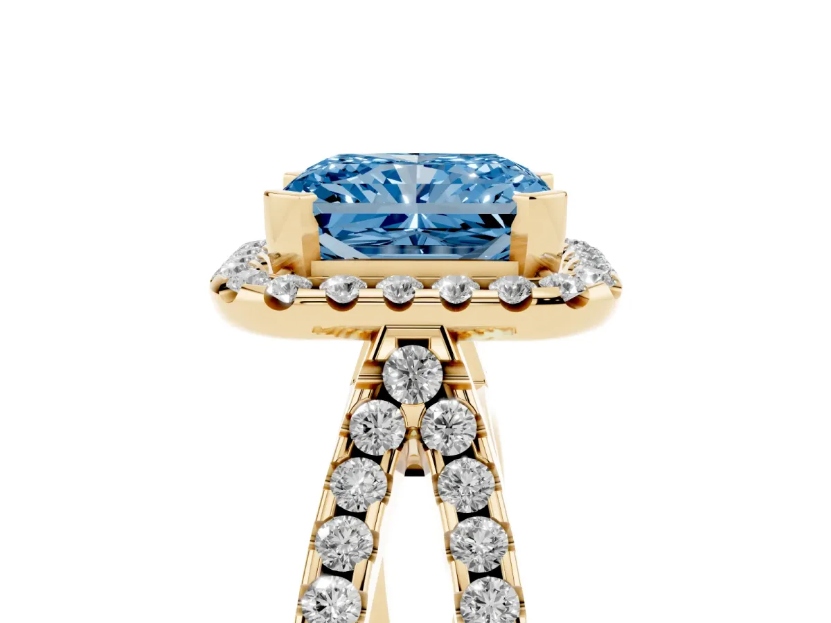 Fancy Blue Radiant Cut Diamond Halo Ring with Split Shank Pavé Band and Prong Setting Yellow gold