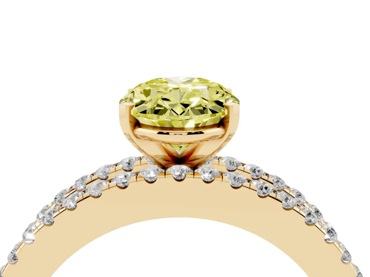 Fancy Yellow Oval Cut Diamond Solitaire Ring with Pavé and Channel Set Band Yellow gold