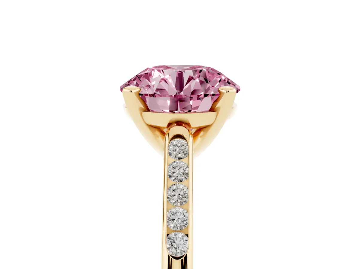 Fancy Pink Round Cut Diamond Solitaire Ring with Channel Set Round Band and Prong Setting Yellow gold