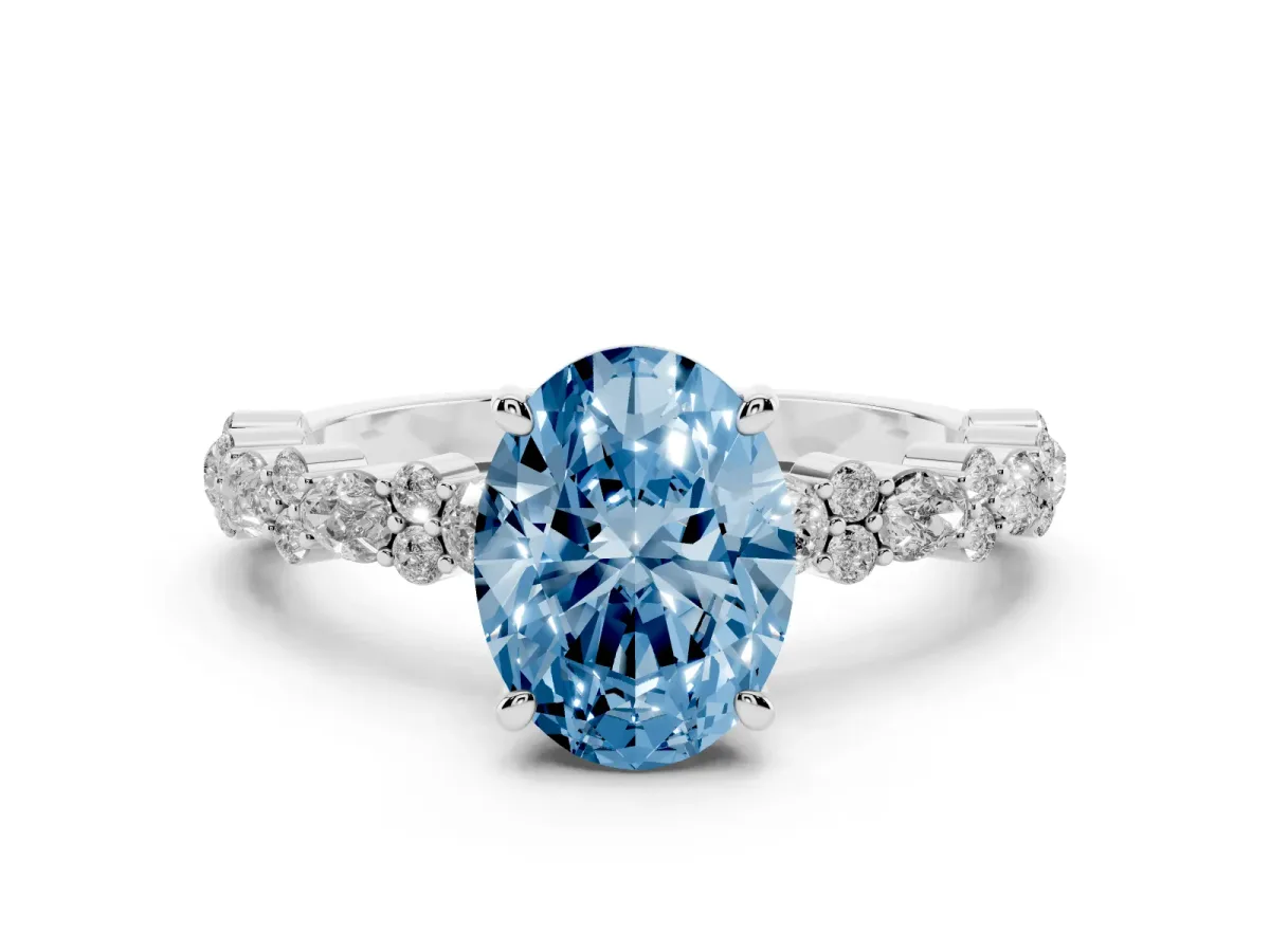 Fancy Blue Oval Cut Diamond Side Stone Solitaire Ring with Round and Four-Prong Setting Silver
