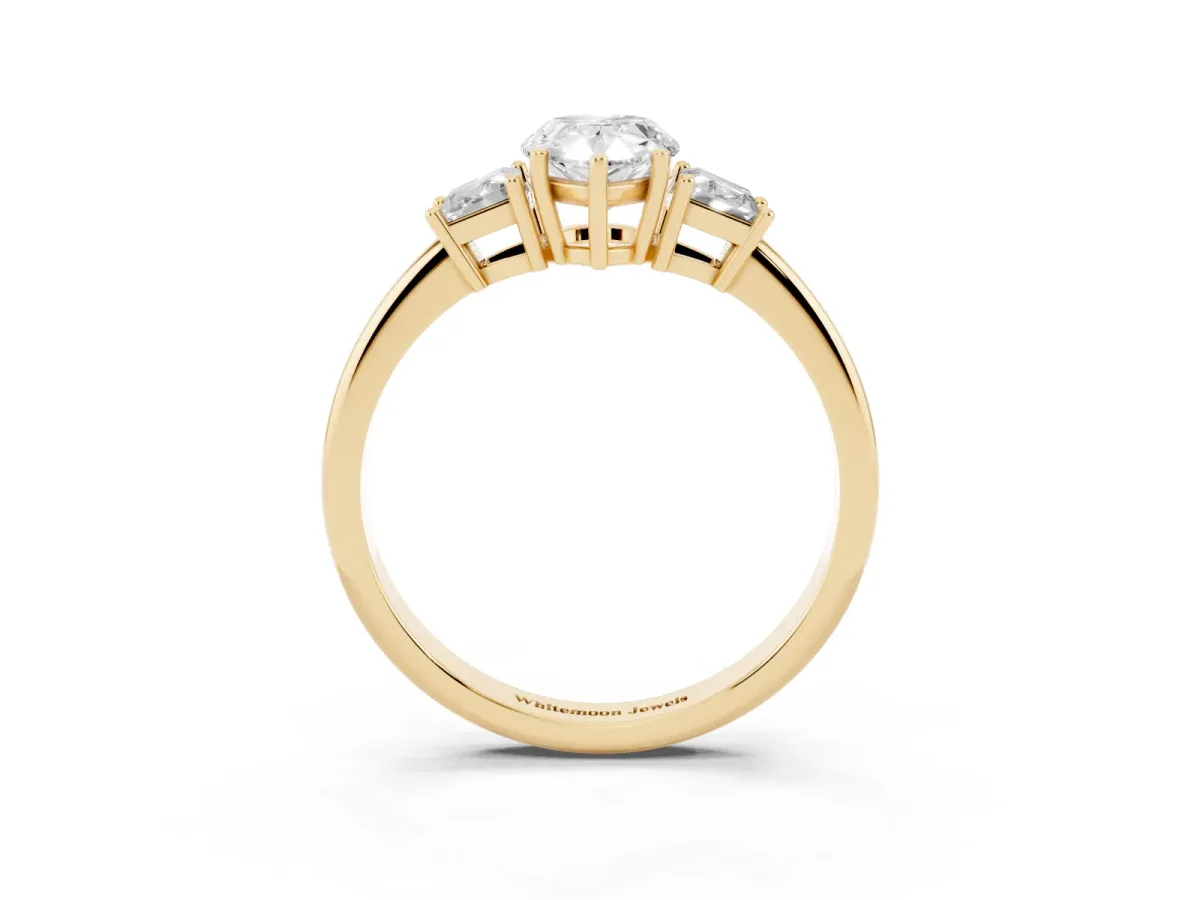 Pear Cut Diamond Three-Stone Ring with Trapezoid Side Stones and Prong Setting Yellow gold