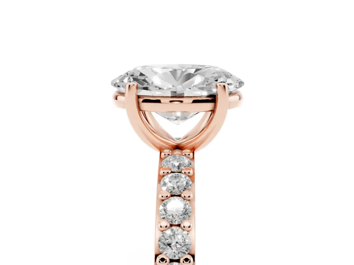 Oval Cut Cut Diamond Solitaire with Pave Band and Four-Prong Setting Rose gold
