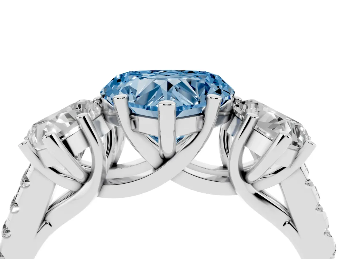 Fancy Blue Three-Stone Heart Cut Diamond Ring with Round Pavé Band and Prong Setting Silver