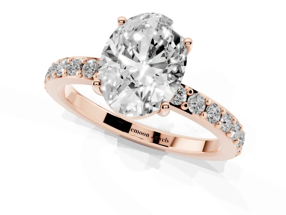 Oval Cut Cut Diamond Solitaire with Pave Band and Four-Prong Setting Rose gold