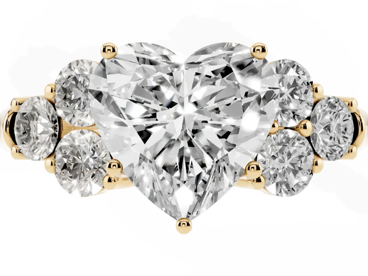 Heart Cut Cut Diamond Cluster Ring with Round Accent Stones and Prong Setting on a Classic Band Yellow gold