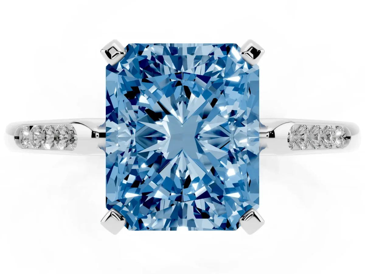 Fancy Blue Radiant Cut Diamond Solitaire Ring with Channel Set Round Band and Prong Setting Silver