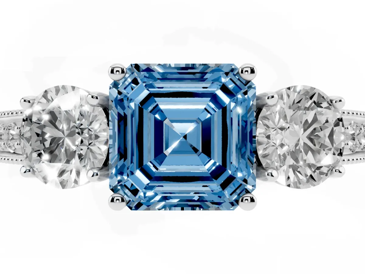 Fancy Blue Asscher Cut Three-Stone Diamond Ring with Pavé Band and Four-Prong Setting Silver