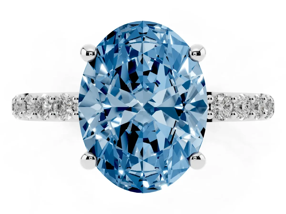 Fancy Blue Oval Cut Diamond Solitaire Ring with Round Pavé Band and Prong Setting Silver