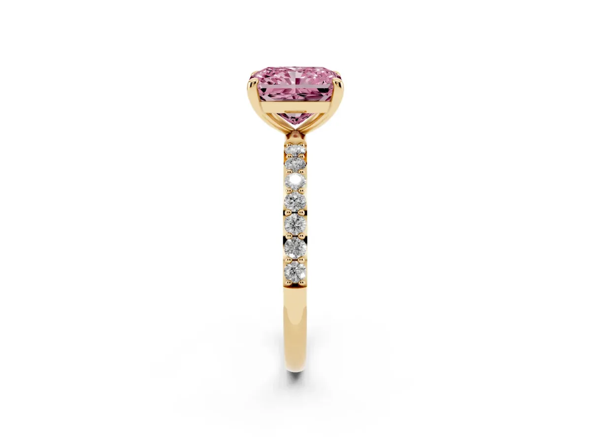 Fancy Pink Radiant Cut Diamond Solitaire Ring with Round Pavé Band and Prong Setting Yellow gold