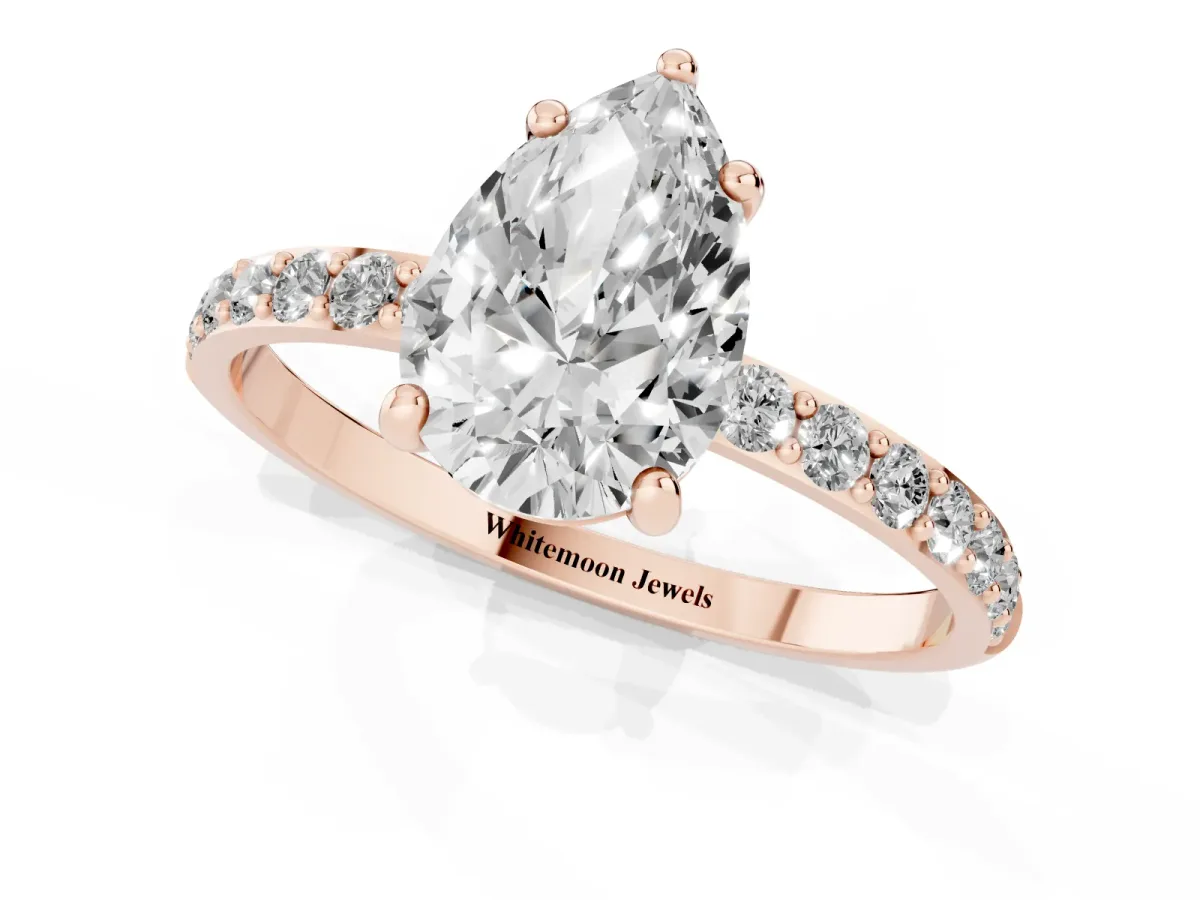 Pear Cut Diamond Solitaire Ring with Round Pavé Band and Prong Setting Rose gold