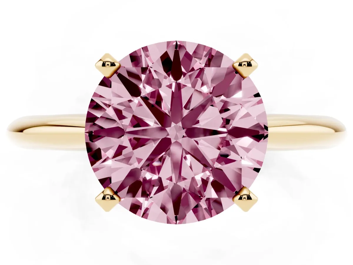 Fancy Pink Round Cut Cut Solitaire Ring with Four-Prong Setting on a Classic Band Yellow gold