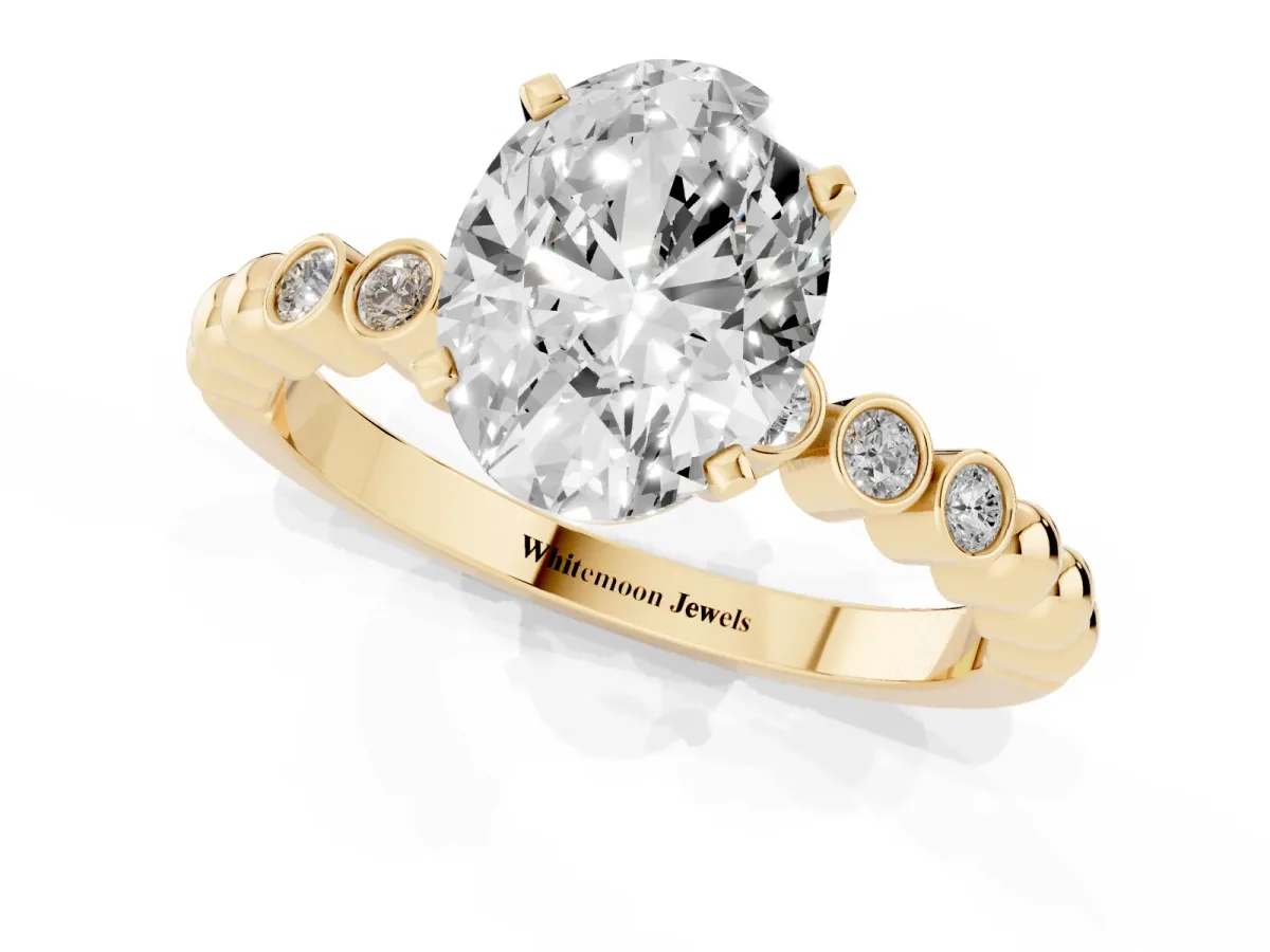 Oval Cut Solitaire Bezel Accent Diamond Engagement Ring with Beaded Band and Four-Prong Setting Yellow gold