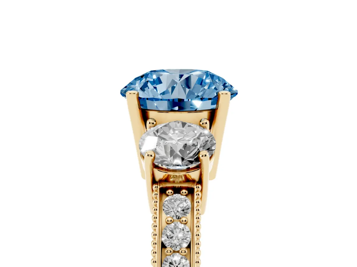 Fancy Blue Round Cut Three-Stone Diamond Ring with Pavé Band and Four-Prong Setting Yellow gold