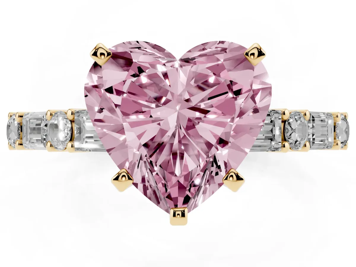 Fancy Pink Heart Cut Diamond Solitaire with Side Baguettes and Channel Set Band Yellow gold