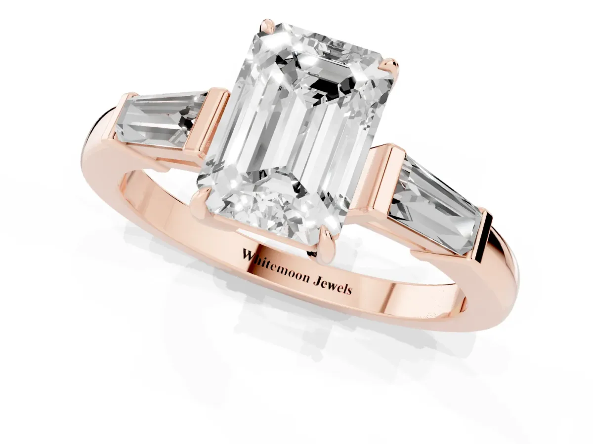 Emerald Cut Diamond Three-Stone Ring with Tapered Baguette Side Stones and Prong Setting Rose gold