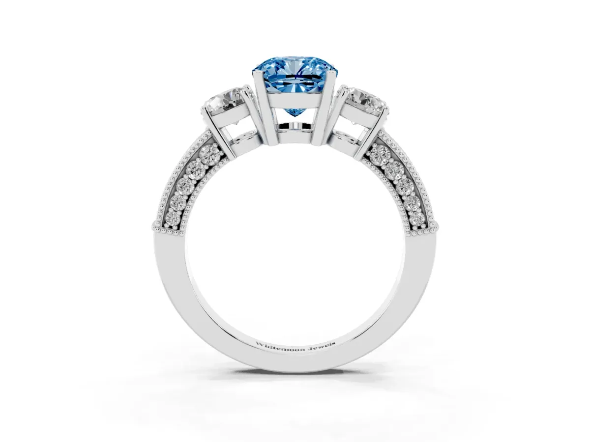 Fancy Blue Cushion Cut Three-Stone Diamond Ring with Pavé Band and Four-Prong Setting Silver
