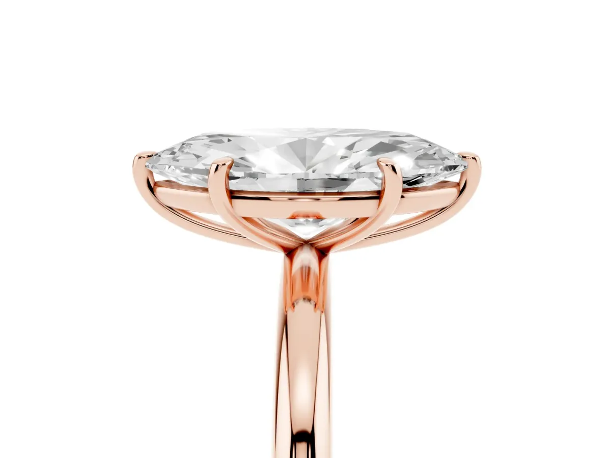 Marquise Cut Solitaire Diamond Ring with Four-Prong Setting on a Plain Band Rose gold