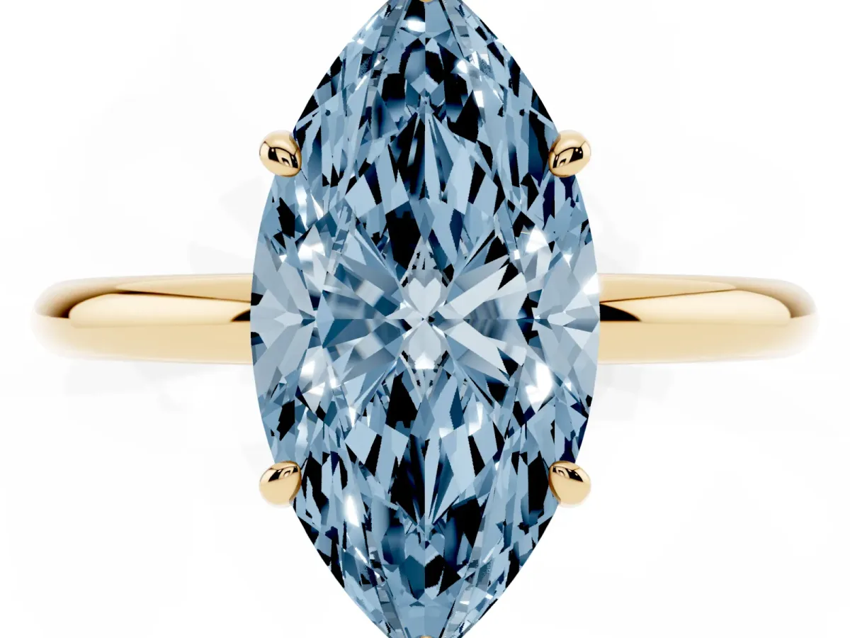 Fancy Blue Oval Cut Solitaire Diamond Ring with Four-Prong Setting on a Plain Band Yellow gold