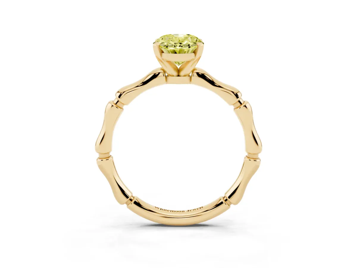 Fancy Yellow Oval Cut Solitaire Diamond Ring with Bamboo Band and Four-Prong Setting Yellow gold