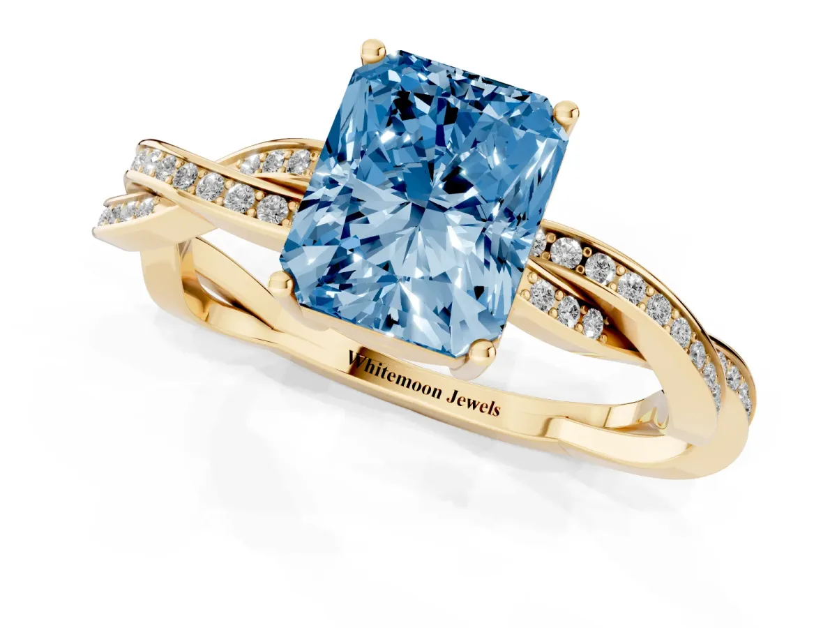 Fancy Blue Radiant Cut Solitaire Twisted Pave Diamond Ring with Four-Prong Setting Yellow gold