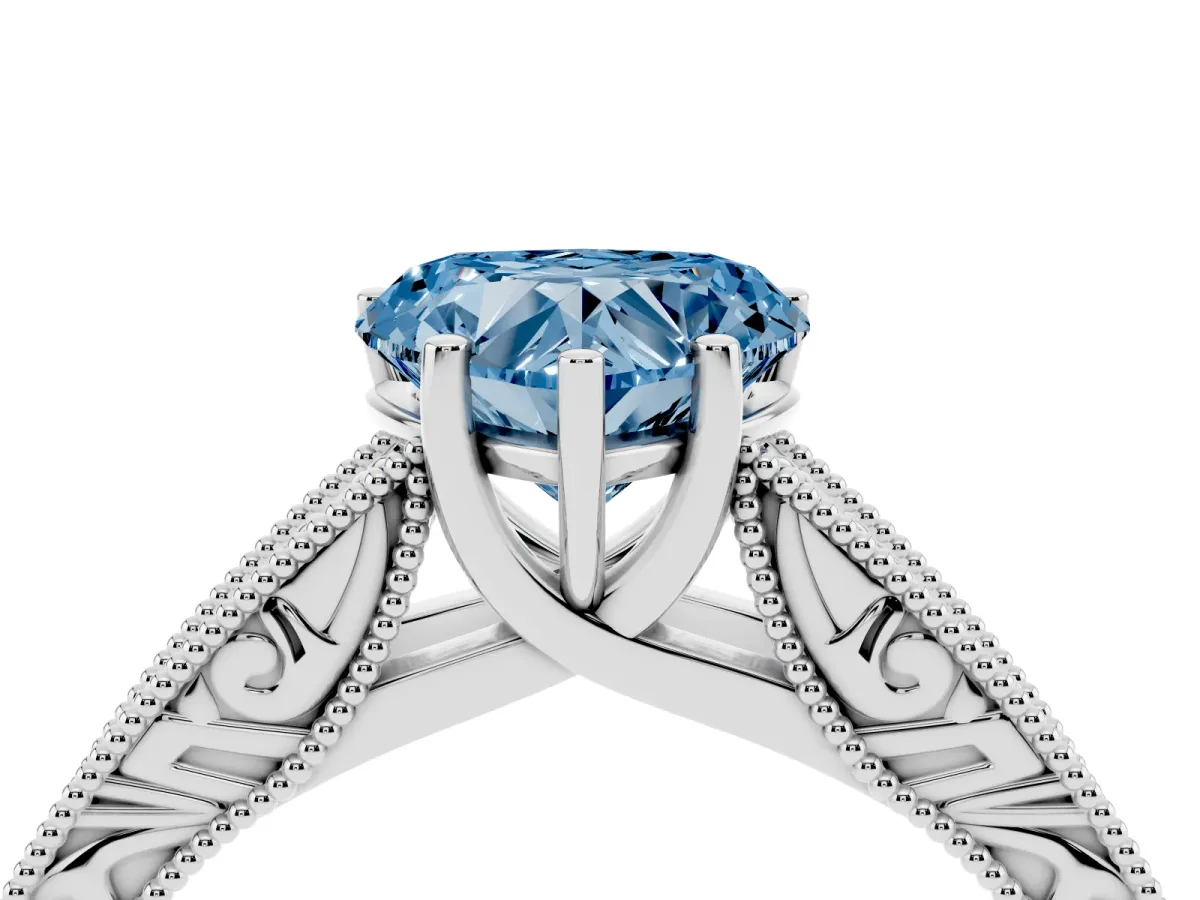 Fancy Blue Heart Cut Diamond Solitaire Ring with Engraved Band and Four-Prong Setting Silver