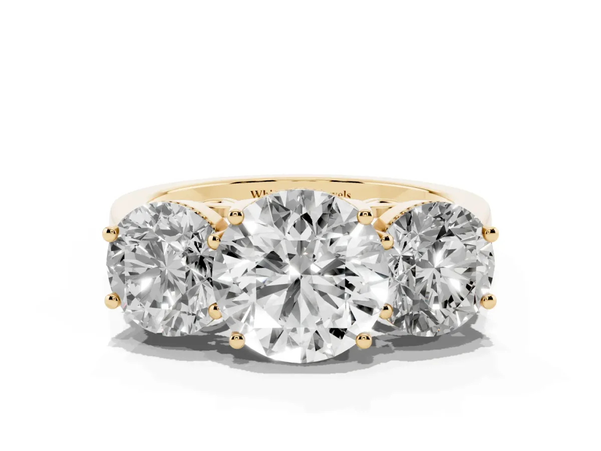 Three-Stone Round Cut Diamond Engagement Ring with Prong Setting on a Classic Band Yellow gold