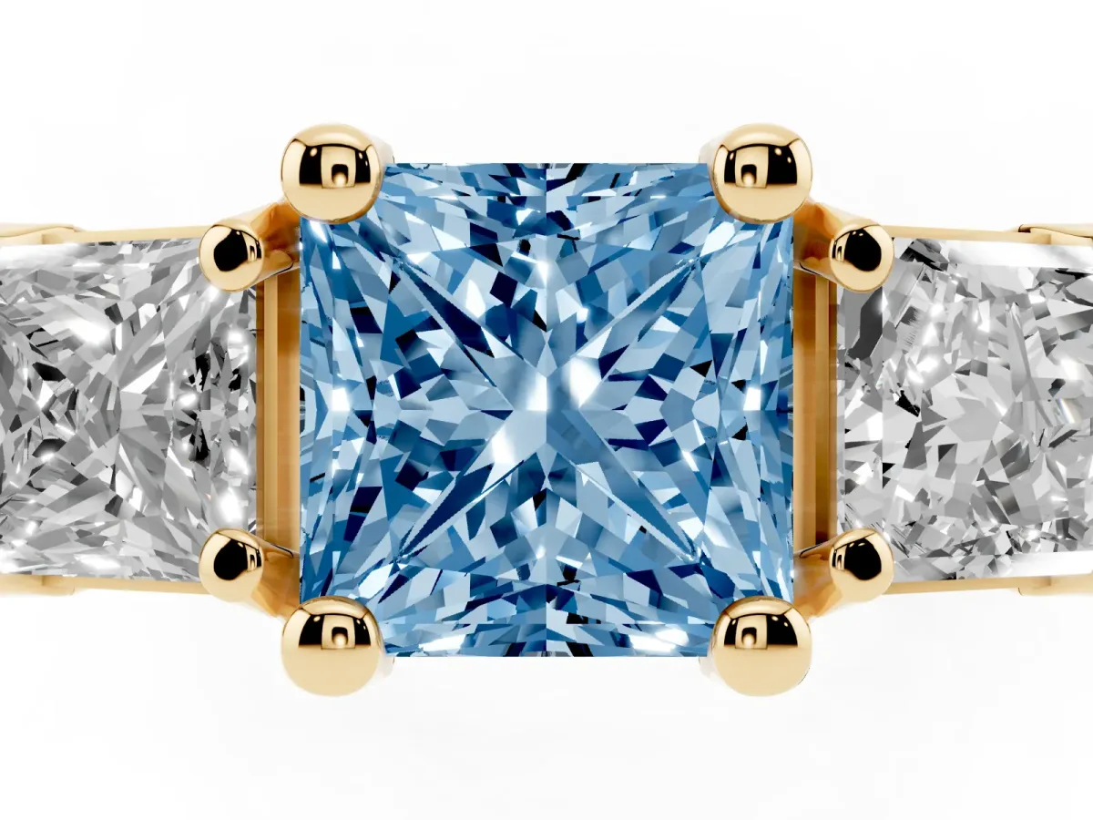 Fancy Blue Princess Cut Diamond Three-Stone Ring with Channel Set Band and Four-Prong Setting Yellow gold