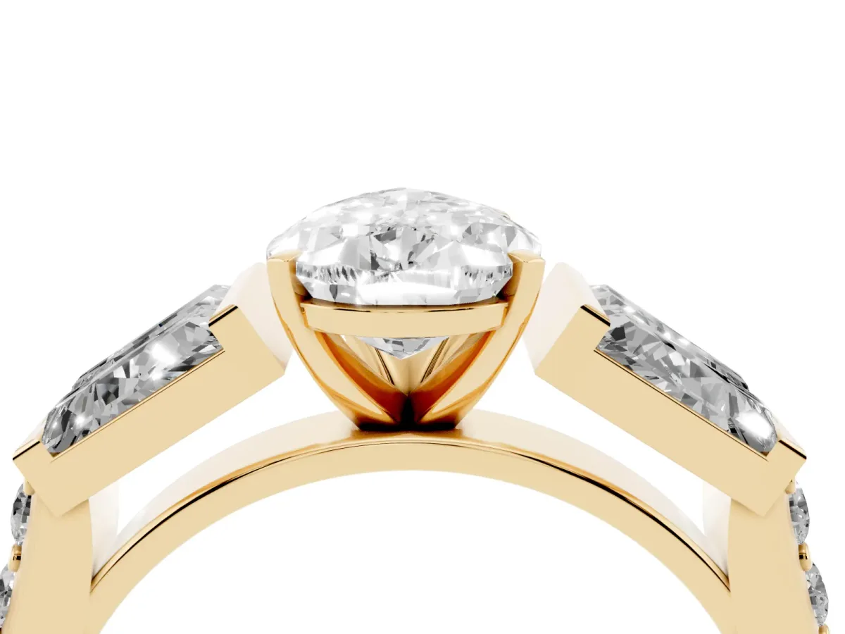 Pear Cut Diamond Engagement Ring with Baguette Side Stones and Channel Set Band Yellow gold