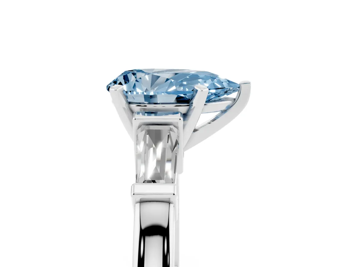 Fancy Blue Pear Cut Cut Diamond Solitaire Ring with Tapered Baguette Accents and Four-Prong Setting White gold