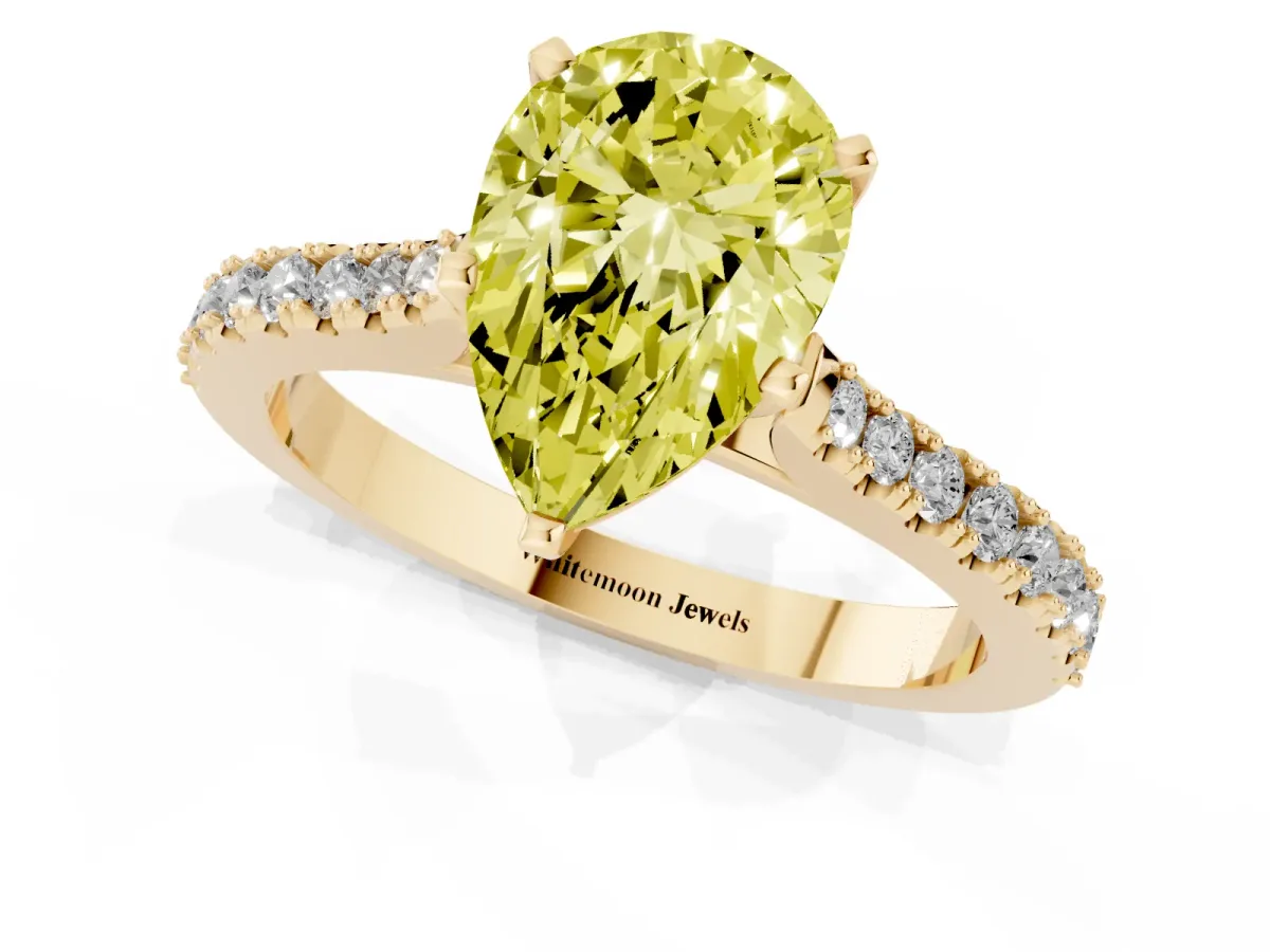 Fancy Yellow Pear Cut Cut Solitaire Diamond Engagement Ring with Pave Band and Four-Prong Setting Yellow gold