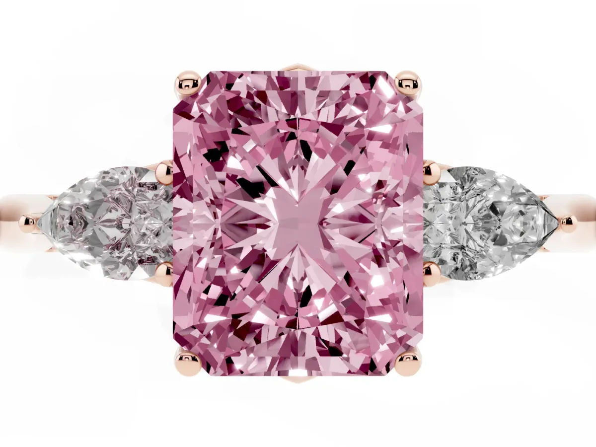 Fancy Pink Three-Stone Radiant Cut Diamond Ring with Pear Side Stones in Four-Prong Setting Rose gold