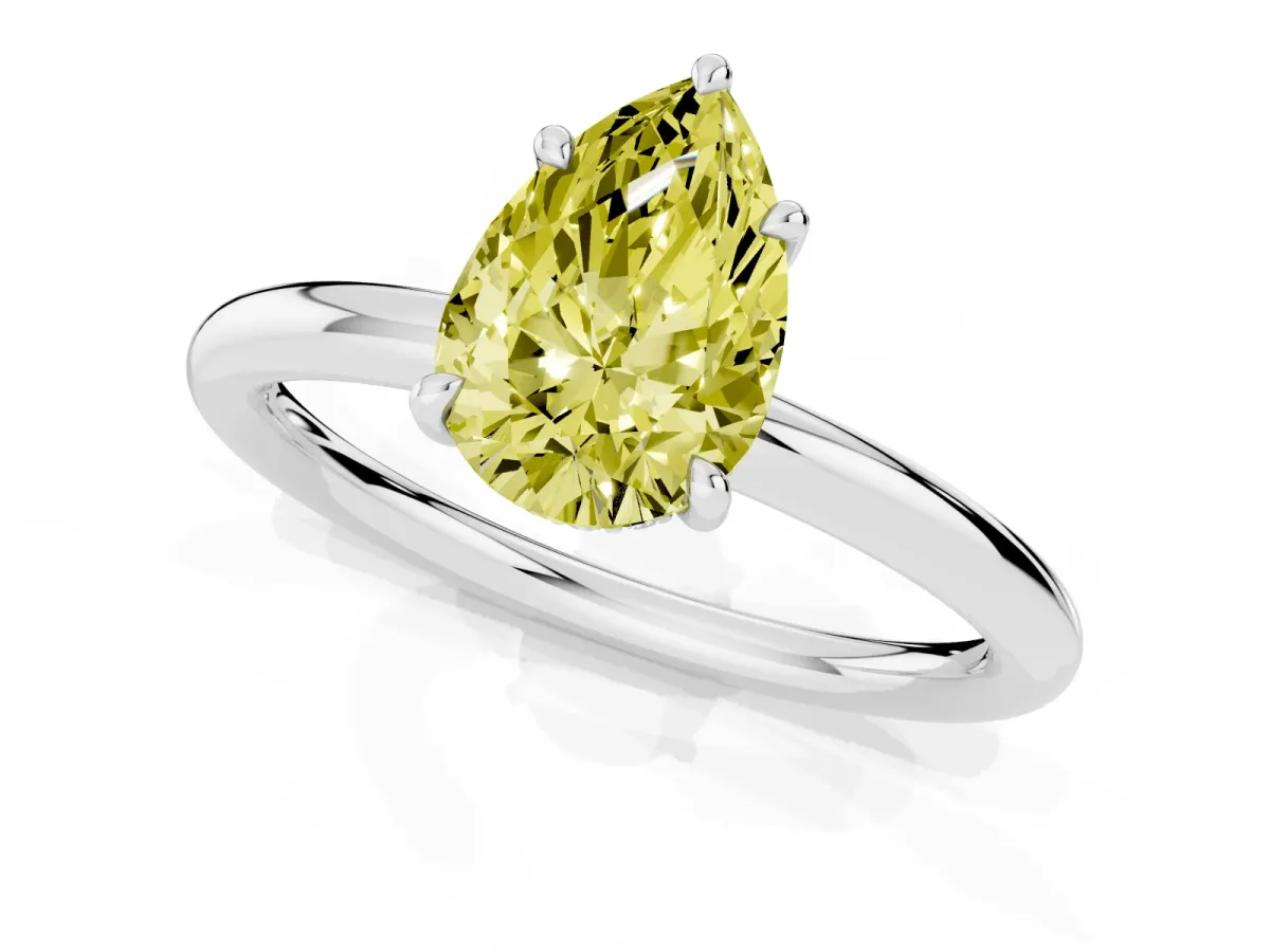 Fancy Yellow Pear Cut Diamond Solitaire Ring with Thin Band and Four-Prong Setting Silver