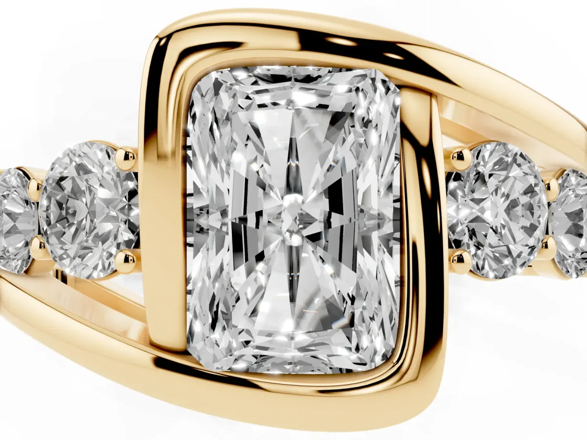 Bezel Set Radiant Cut Diamond Bypass Ring with Round Accents Yellow gold