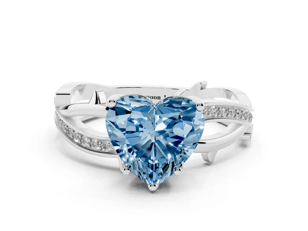 Fancy Blue Heart Cut Solitaire Twist Band with Pavé Accents and Four-Prong Setting Silver