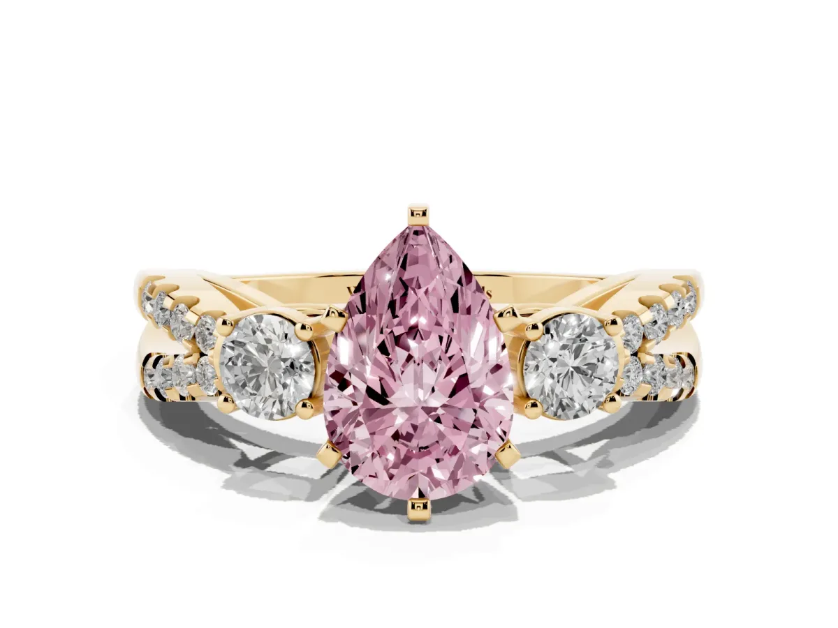 Fancy Pink Pear Cut Diamond Three-Stone Ring with Pavé Split Shank and Four-Prong Setting Yellow gold