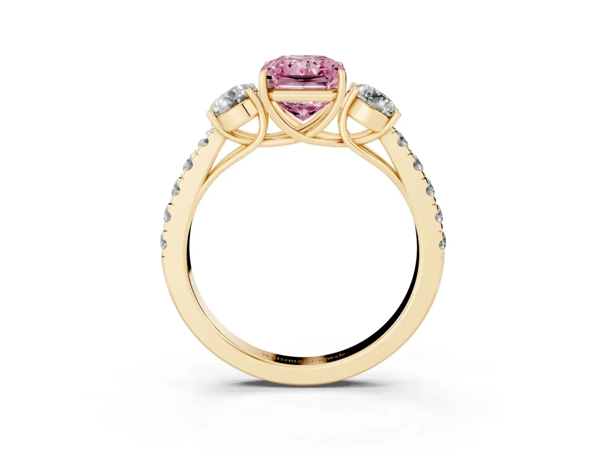 Fancy Pink Radiant Cut Cut Diamond Three-Stone Ring with Round Side Stones and Pavé Band Yellow gold