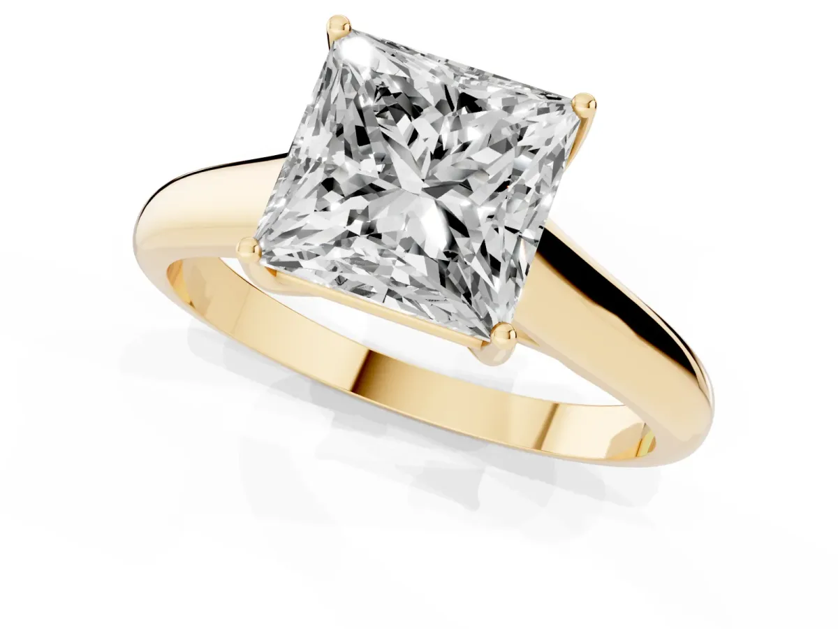 Princess Cut Solitaire Engagement Ring with Tapered Band and Four-Prong Setting Yellow gold