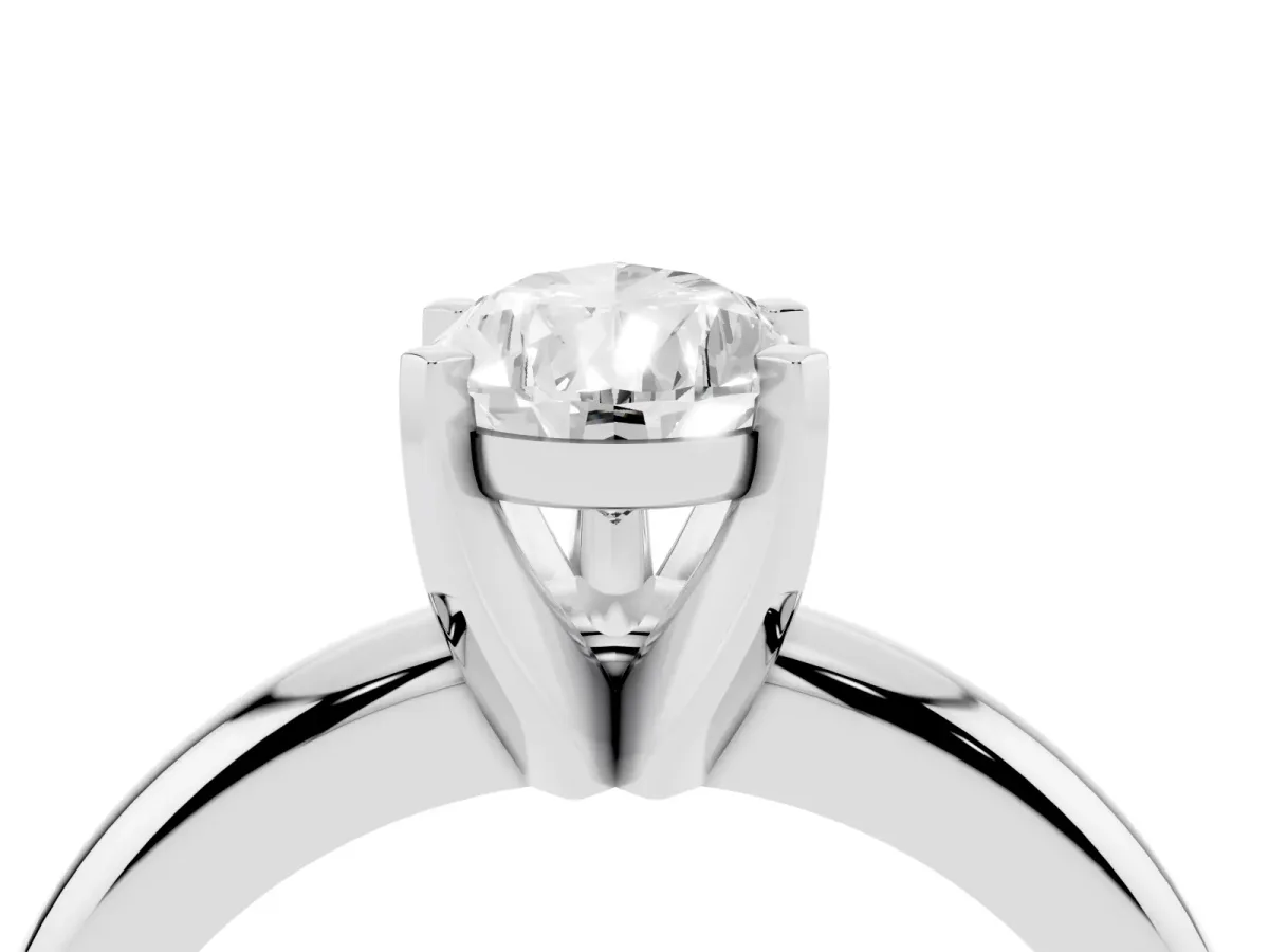 Pear Cut Diamond Solitaire Engagement Ring with Round Band and Four-Prong Setting White gold